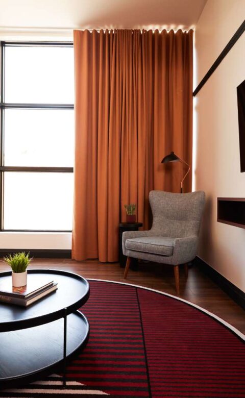 a living room filled with furniture and a flat screen tv